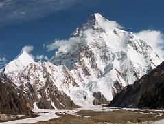 
Just after leaving Concordia, I looked up the Godwin Austin Glacier as the sun finally hit the K2 West Face, with Angel Peak (Angelus Peak) coming into view on the left. The K2 Southwest Pillar separates the sunlit South Face from the West Face mostly in shadow to the left. The South-southeast Spur is now lit up by the sun and arrives at the K2 Shoulder on the right. On the far right is the Abruzzi Ridge / Spur, the East-southeast ridge, the normal ascent route.
